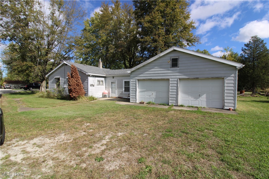 5084 West Fremont Road Port Clinton, OH 43452 - Photo 4 of 19 Single story home featuring a front lawn and a garage