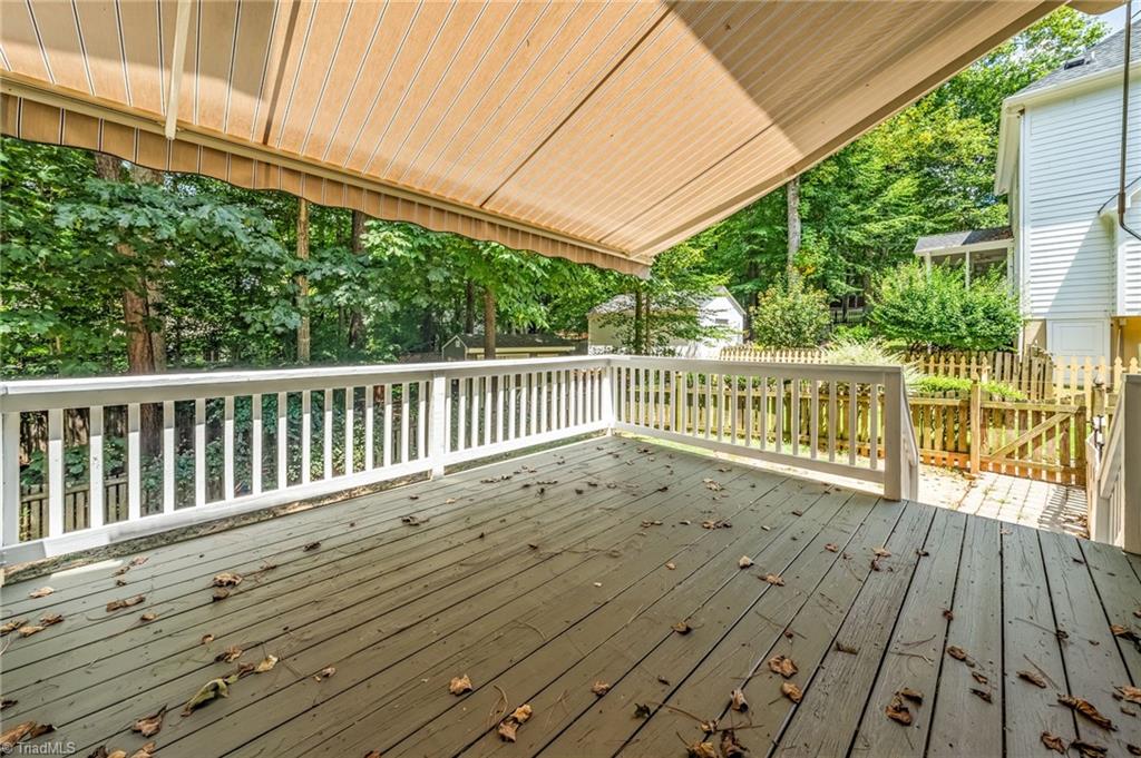 1041 Barnford Mill Road Wake Forest, NC 27587 - Photo 32 of 41 freshly painted deck with retractable awning