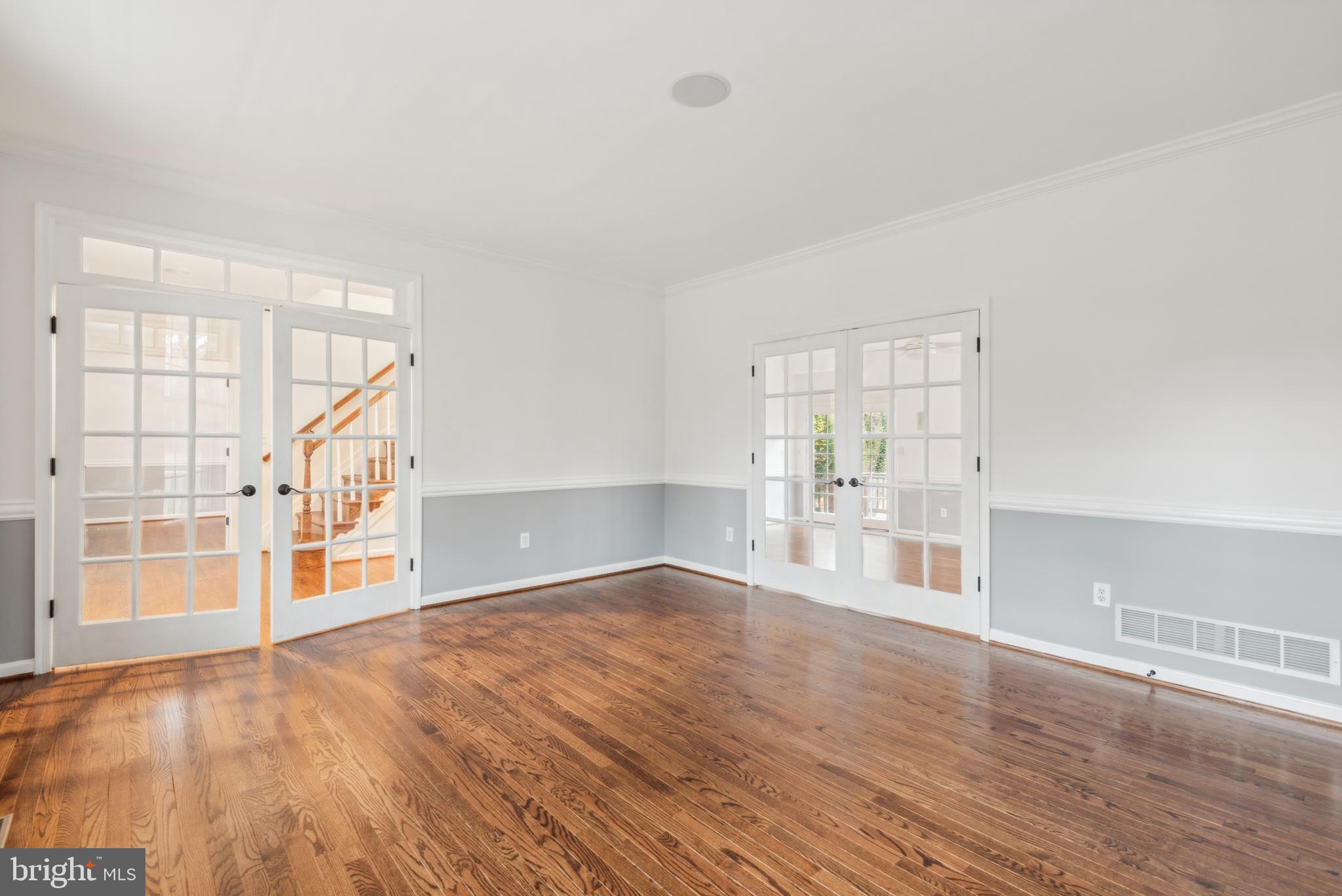 1825 Johnson Road Annapolis, MD 21409 - Photo 6 of 44 wooden floor in an empty room with a window
