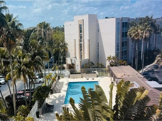 a view of yard with swimming pool and furniture