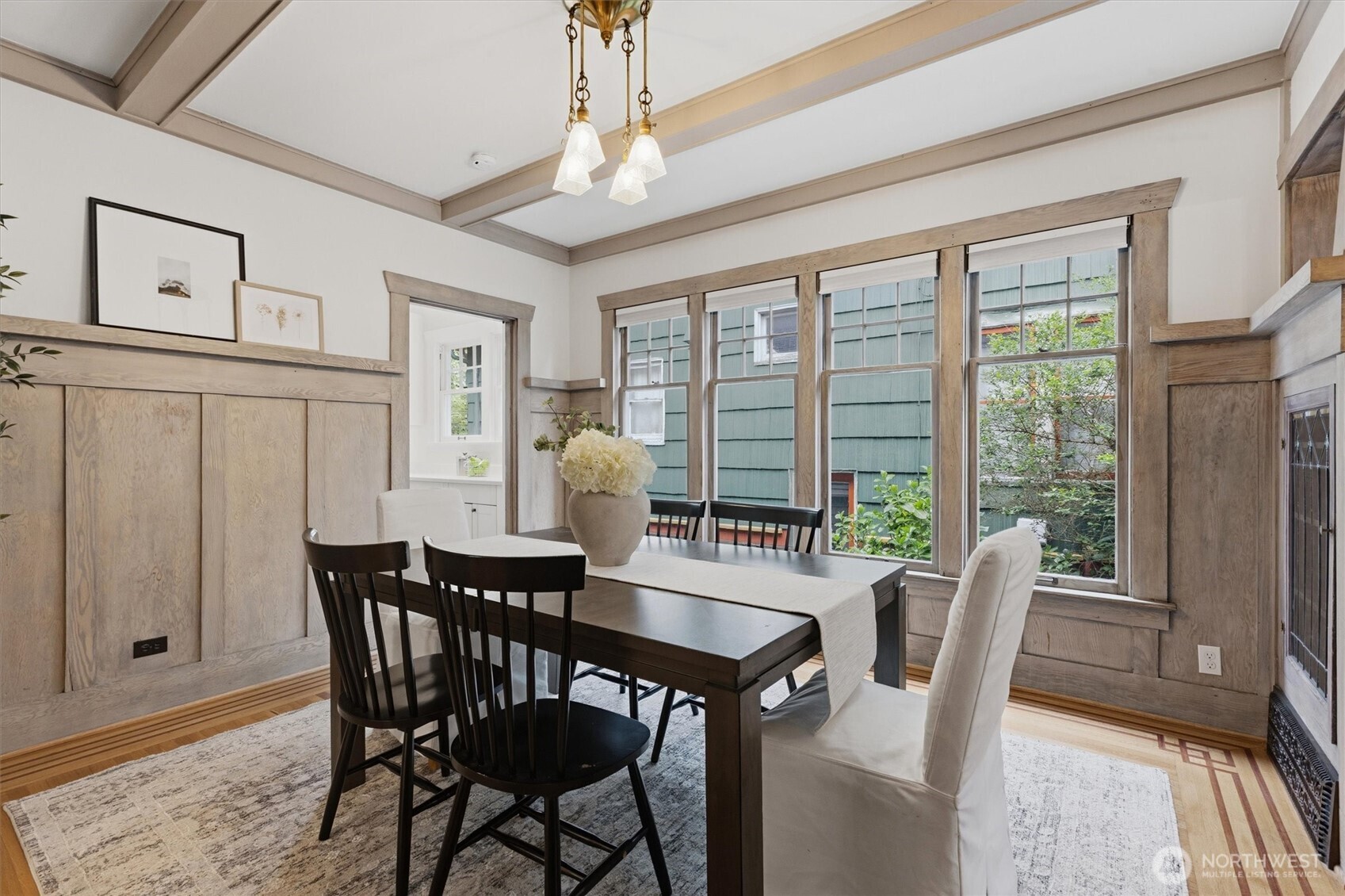 715 North 48th Street Seattle, WA 98103 - Photo 13 of 37 a view of a dining room with furniture window and wooden floor