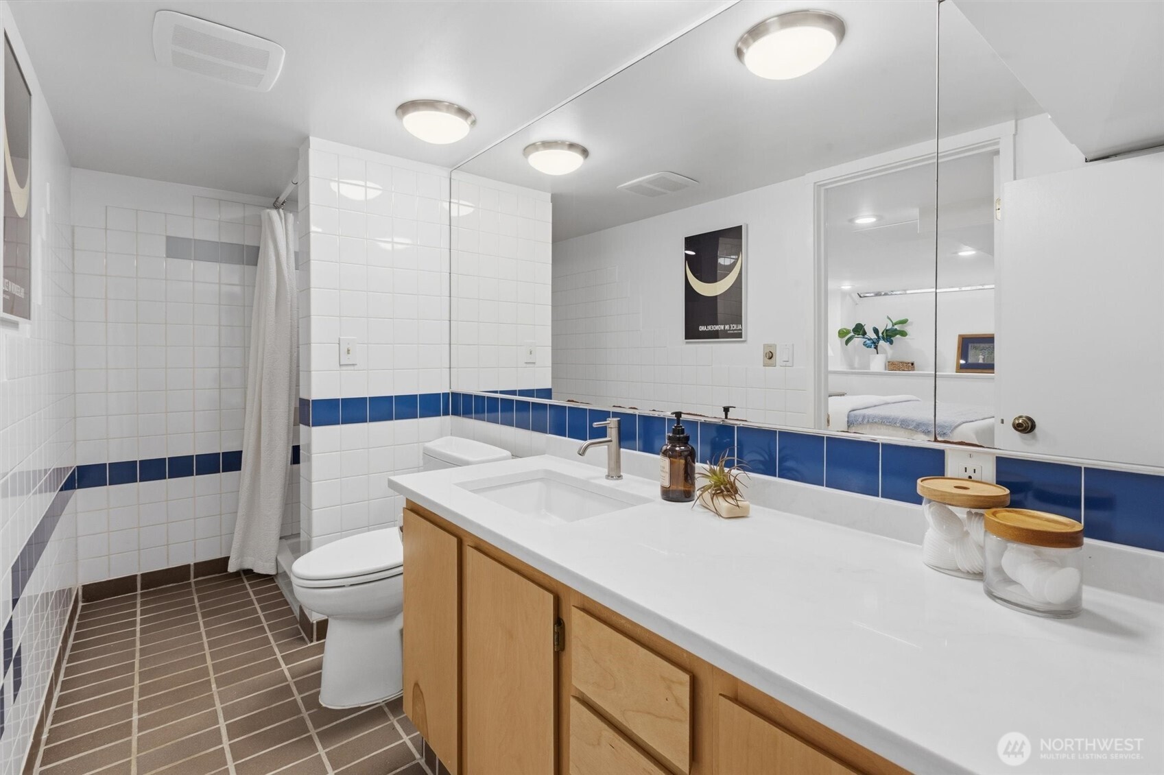 715 North 48th Street Seattle, WA 98103 - Photo 25 of 37 a bathroom with a sink toilet and shower