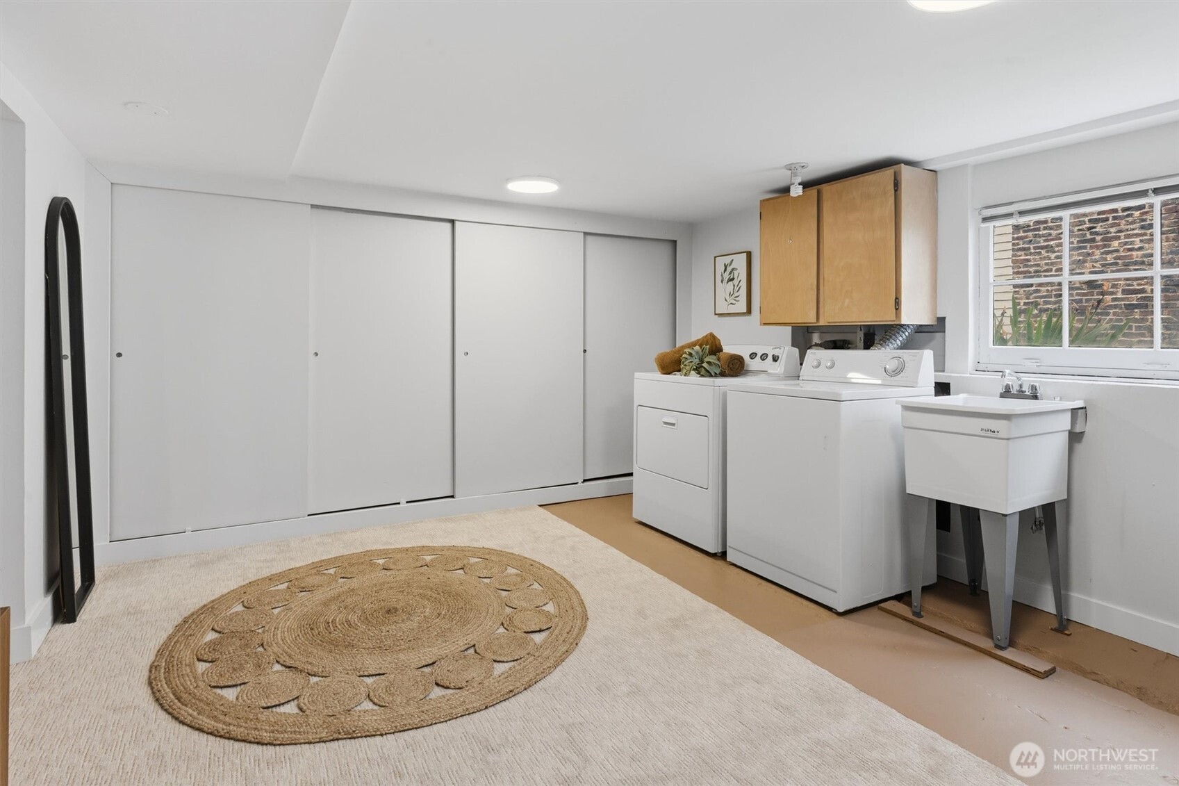715 North 48th Street Seattle, WA 98103 - Photo 29 of 37 a view of a kitchen with sink dishwasher and furniture