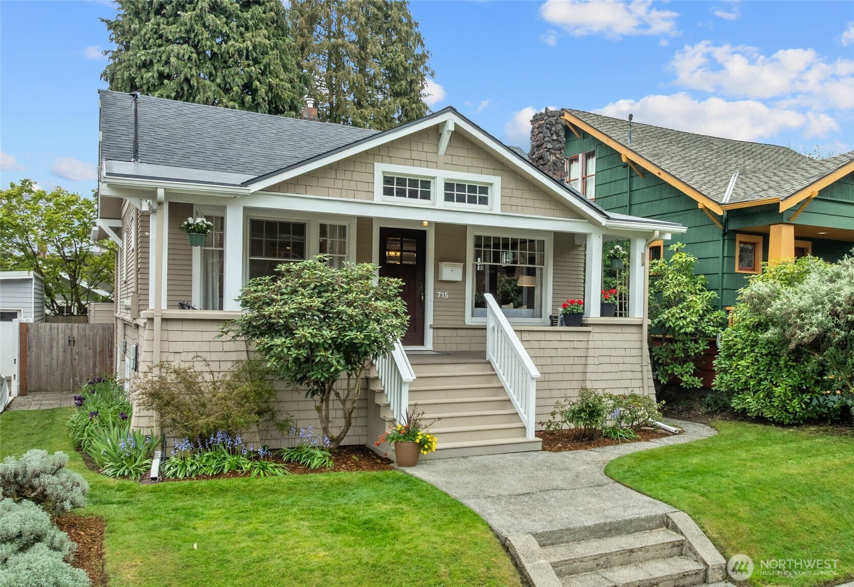715 North 48th Street Seattle, WA 98103 - Photo 31 of 37 a front view of a house with a yard