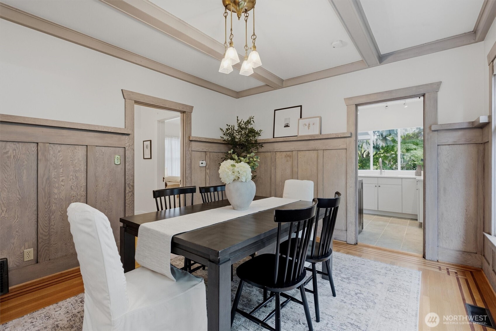 715 North 48th Street Seattle, WA 98103 - Photo 7 of 37 a view of a dining room with furniture window and wooden floor