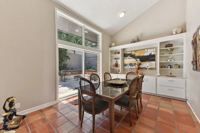 a view of a dining room with furniture and window