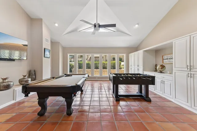 a bedroom with a large bed and a couch