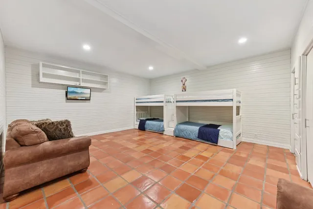 a spacious bathroom with a double vanity sink mirror and toilet