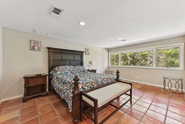 a spacious bathroom with a double vanity sink and a mirror