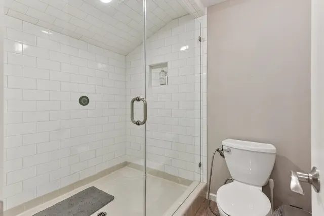 a spacious bedroom with a bed and a window