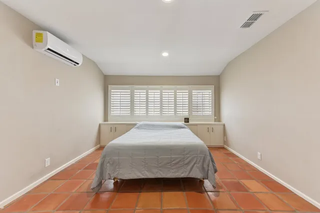 a spacious bathroom with a double vanity sink a mirror and a shower