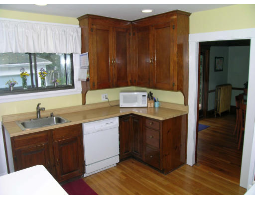 79 Withington Road Newton, MA 02460 - Photo 7 of 12 a kitchen with a sink cabinets and wooden floor