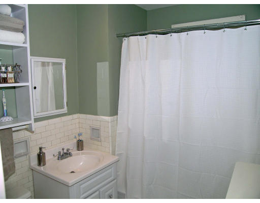 79 Withington Road Newton, MA 02460 - Photo 9 of 12 a bathroom with a sink and a mirror