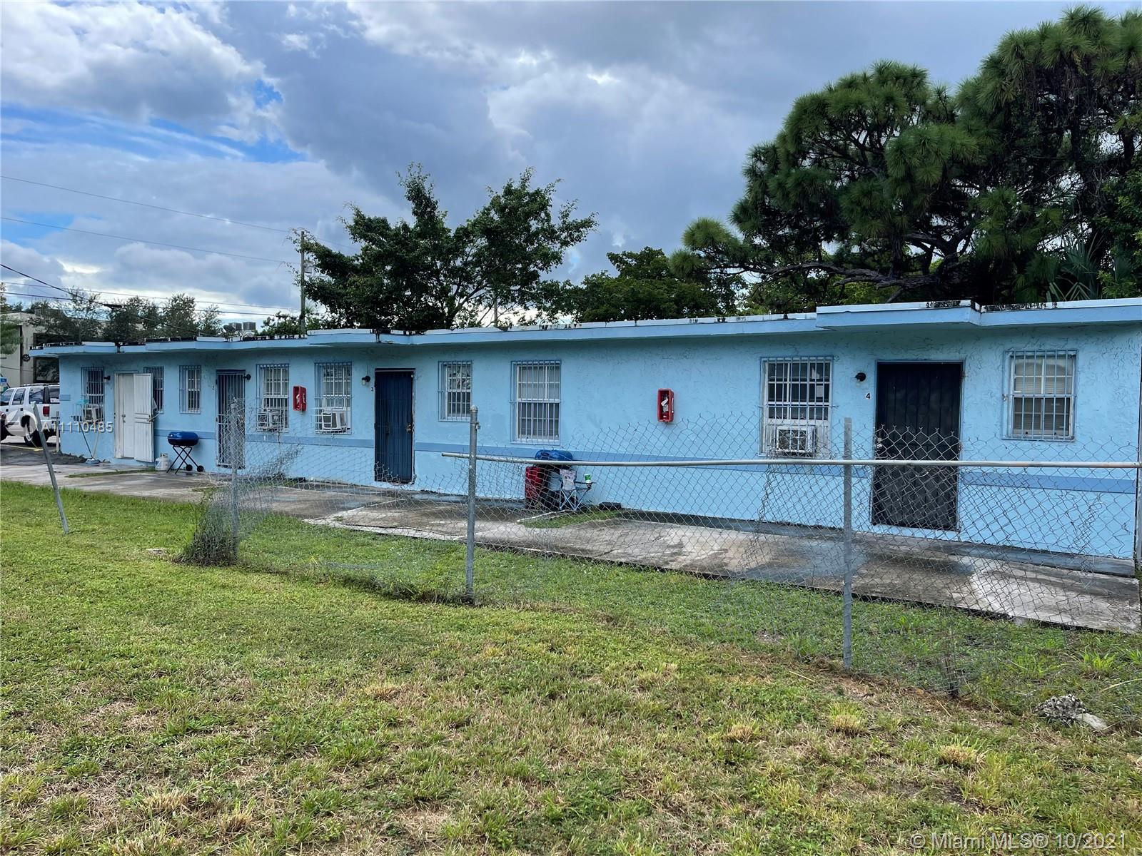 a front view of house with yard and outdoor seating