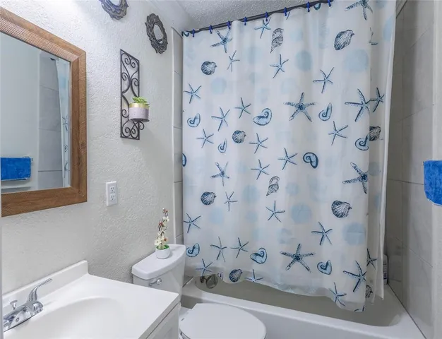 a bathroom with a sink and toilet