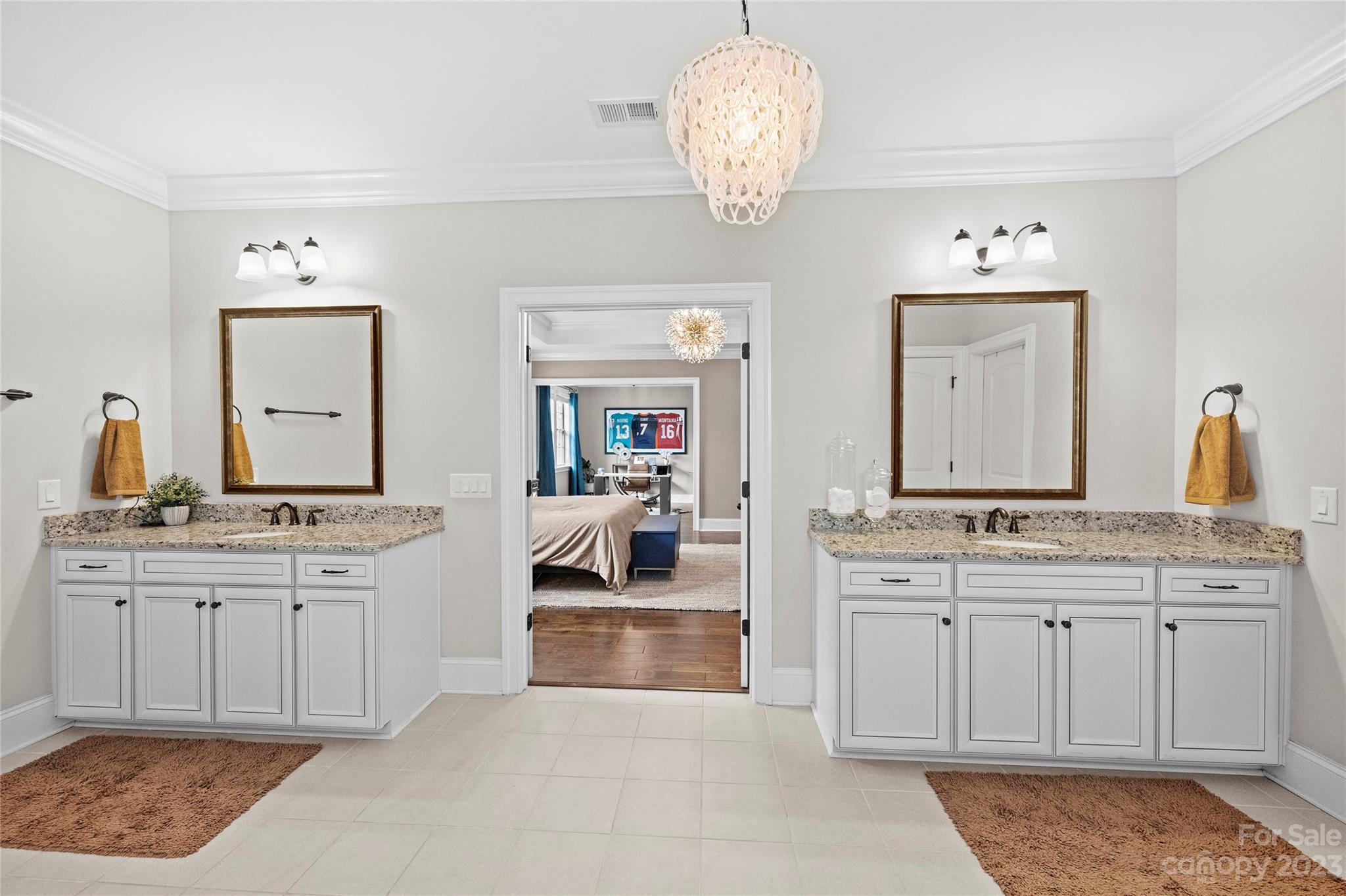 658 Zinnia Way Tega Cay, SC 29708 - Photo 19 of 32 a spacious bathroom with a granite countertop double vanity sink mirror and