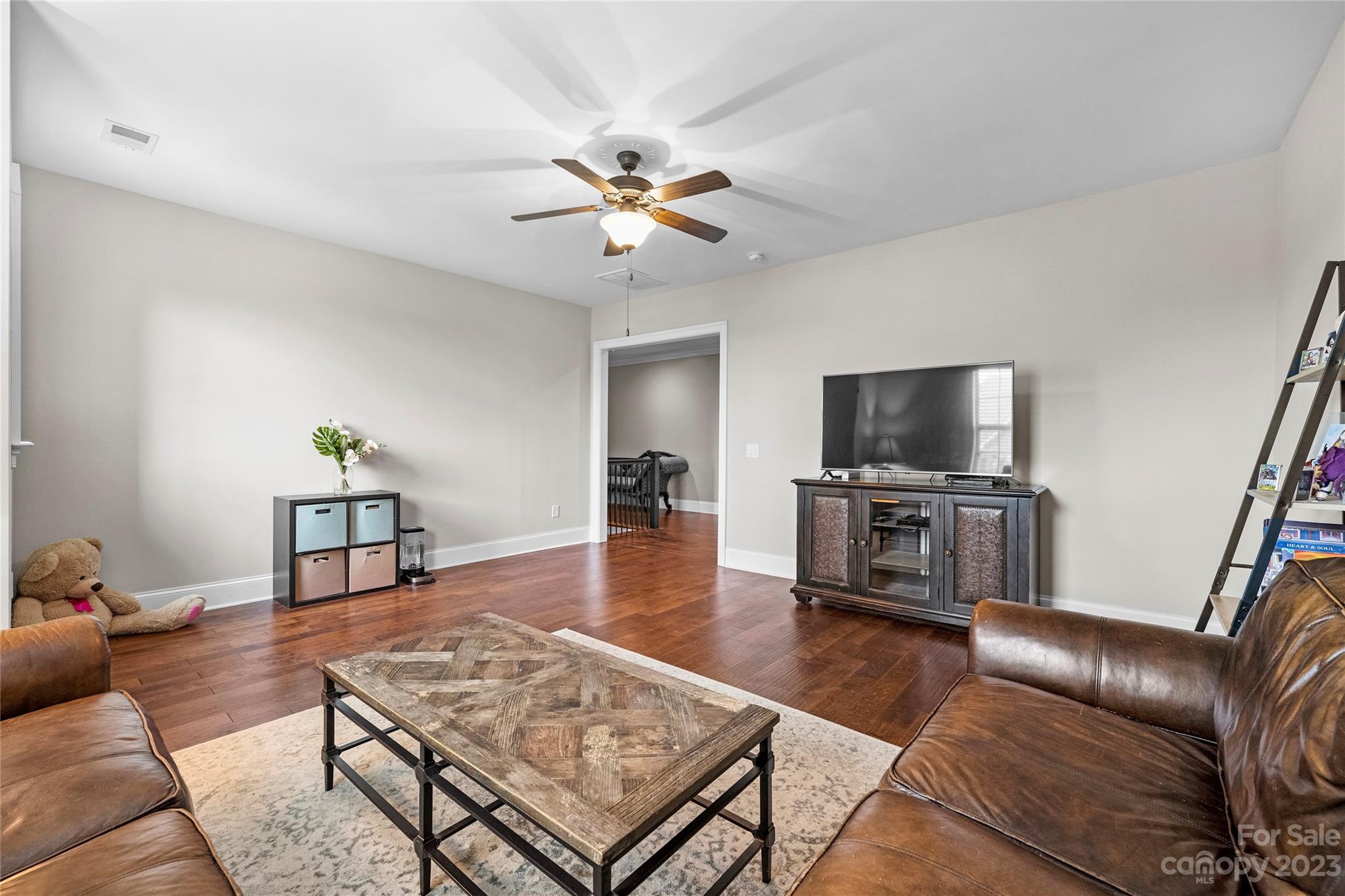 658 Zinnia Way Tega Cay, SC 29708 - Photo 22 of 32 a living room with furniture and a flat screen tv