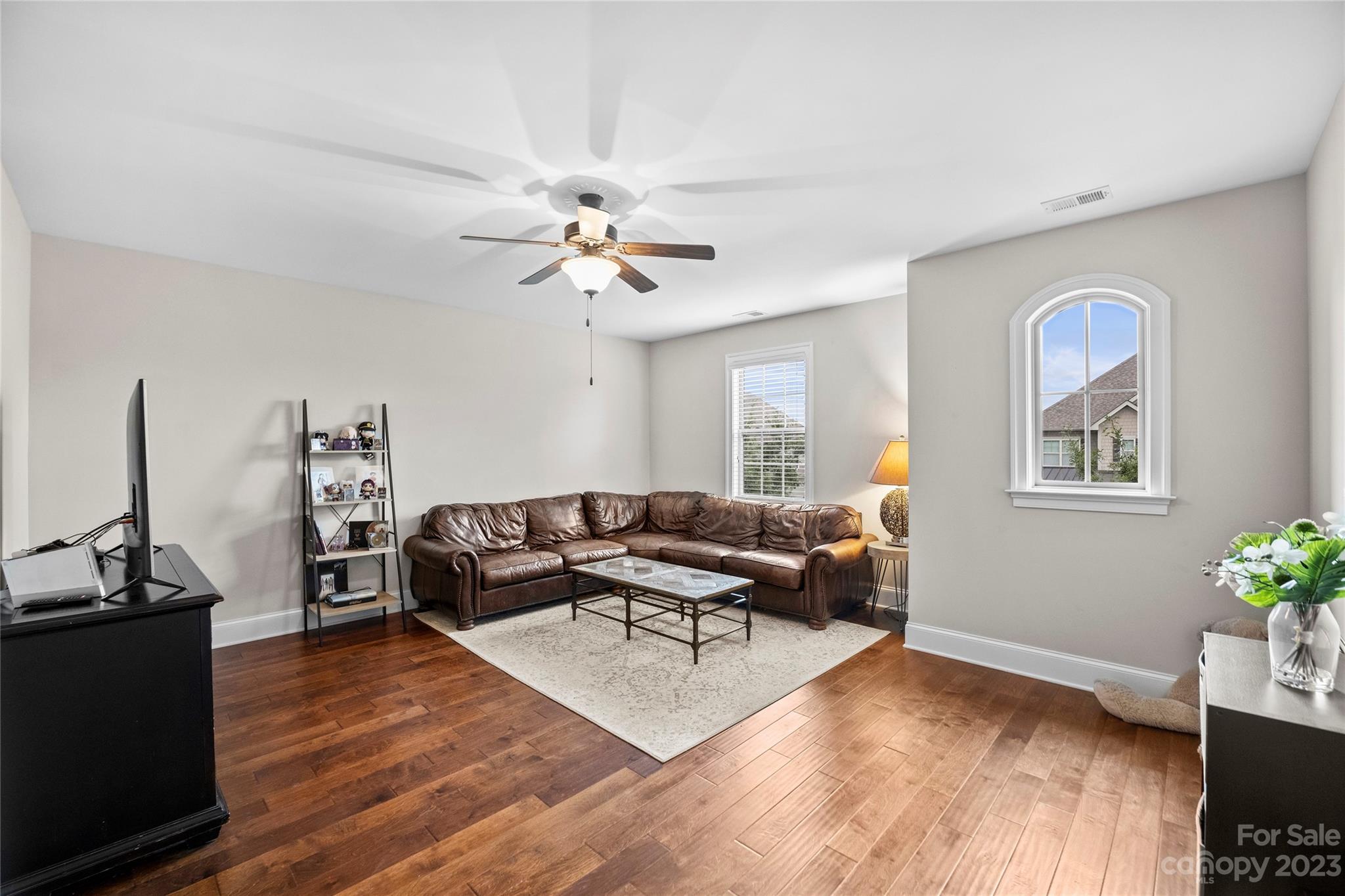 658 Zinnia Way Tega Cay, SC 29708 - Photo 23 of 32 a living room with furniture and wooden floor