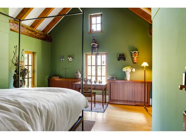 a bedroom with a bed and window