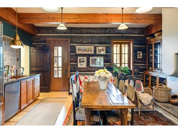 a view of a dining room with furniture and window