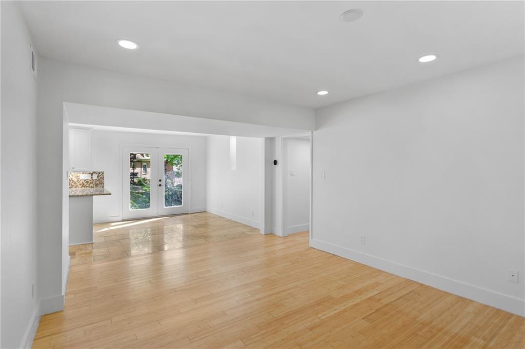 1261 Lavista Road Northeast, Unit C3 Atlanta, GA 30324 - Photo 5 of 34 a view of empty room with wooden floor and fan
