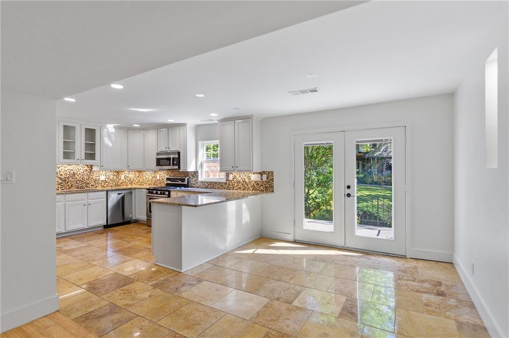 1261 Lavista Road Northeast, Unit C3 Atlanta, GA 30324 - Photo 7 of 34 a kitchen with a sink and counter top space