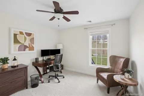 a work room with furniture and windows