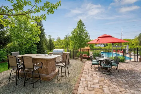 a view of a dining table and chairs in the patio