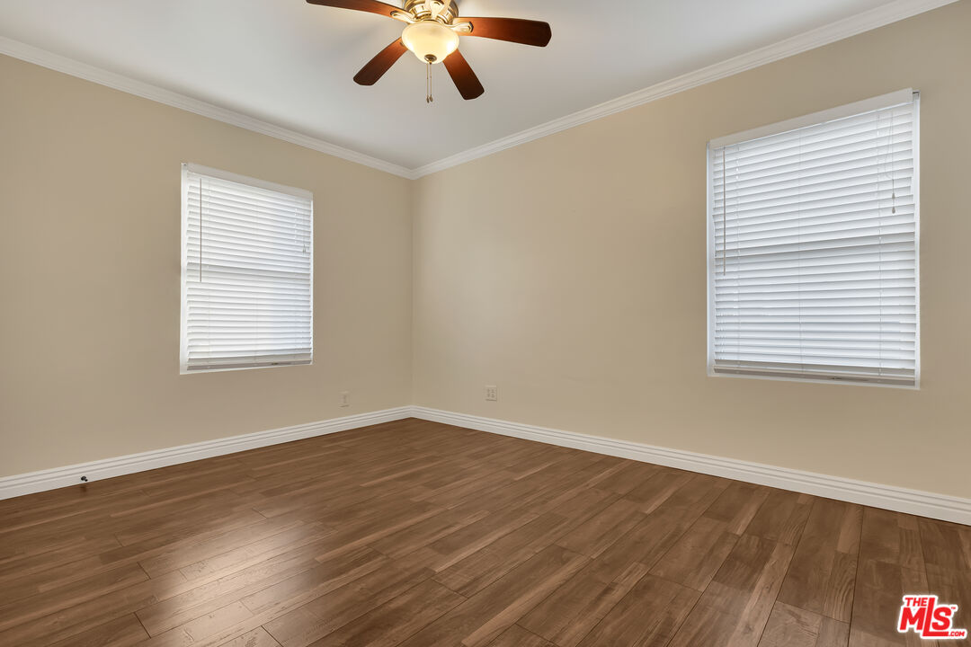 6677 West 88th Street Los Angeles, CA 90045 - Photo 12 of 23 a view of an empty room with wooden floor and a window