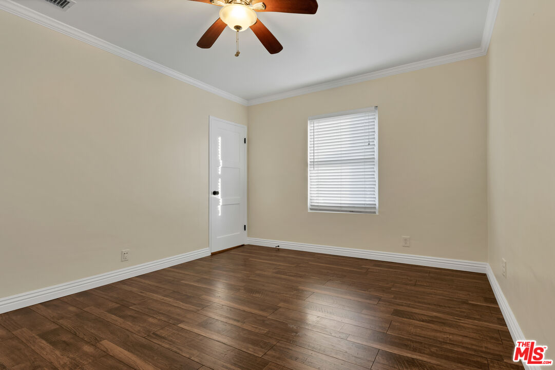 6677 West 88th Street Los Angeles, CA 90045 - Photo 13 of 23 a view of an empty room with wooden floor and a window