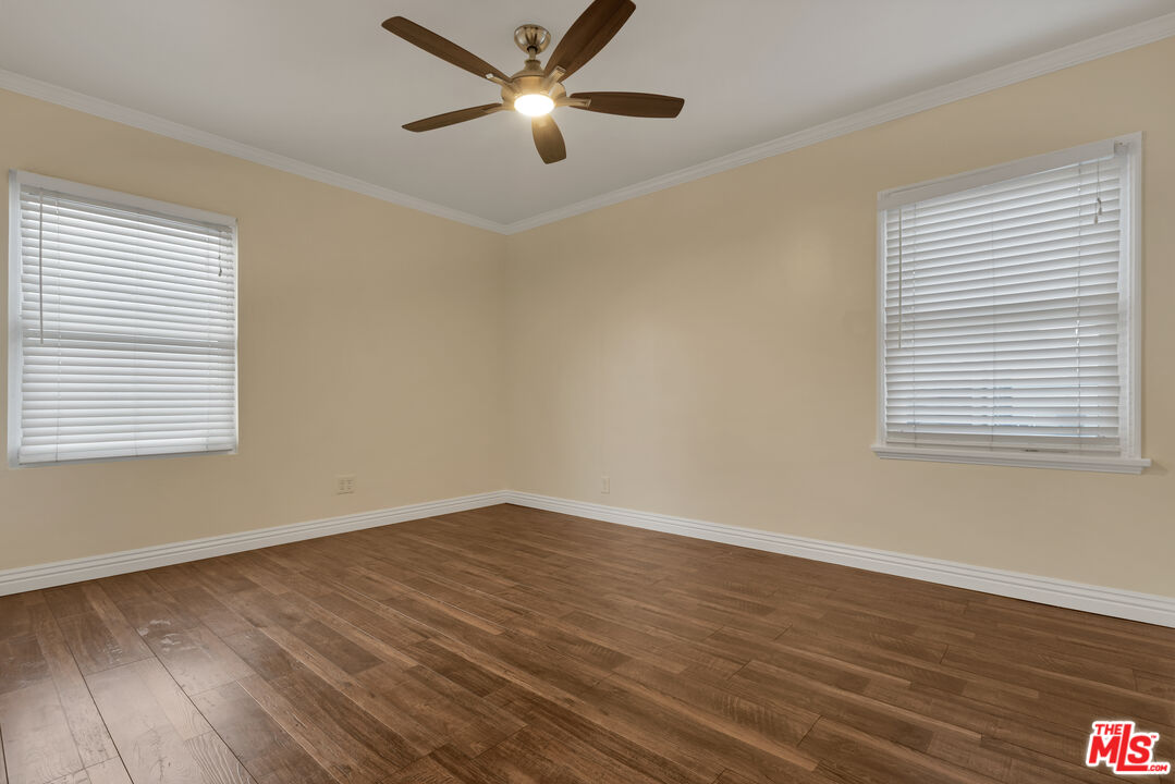 6677 West 88th Street Los Angeles, CA 90045 - Photo 14 of 23 a view of an empty room with wooden floor and a window