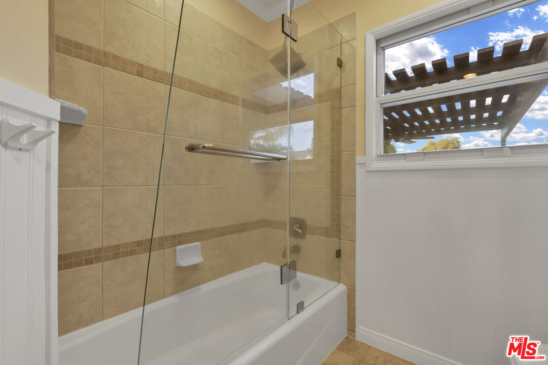6677 West 88th Street Los Angeles, CA 90045 - Photo 17 of 23 a bathroom with a bathtub and shower