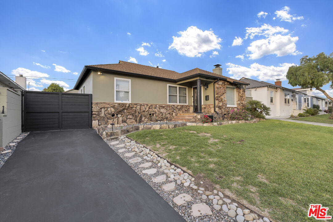 6677 West 88th Street Los Angeles, CA 90045 - Photo 2 of 23 a front view of a house with garden