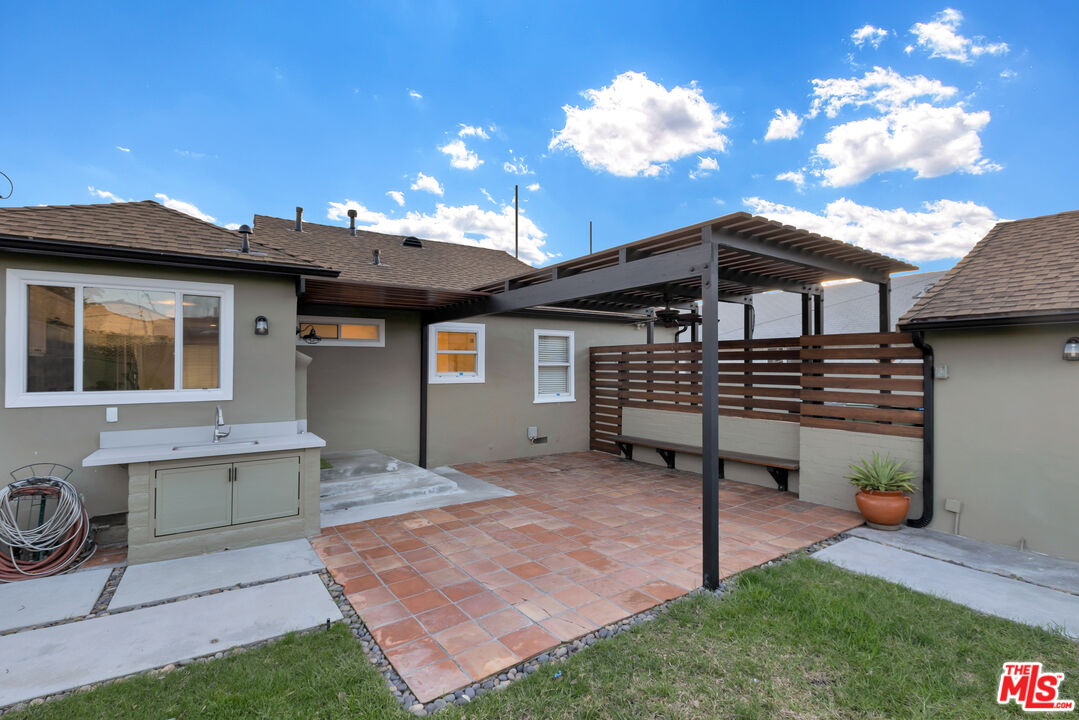 6677 West 88th Street Los Angeles, CA 90045 - Photo 21 of 23 a front view of a house with a garden