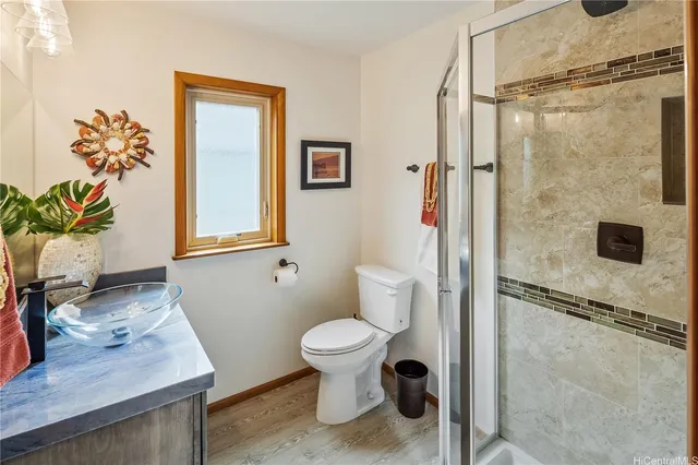 a bathroom with a toilet sink and shower