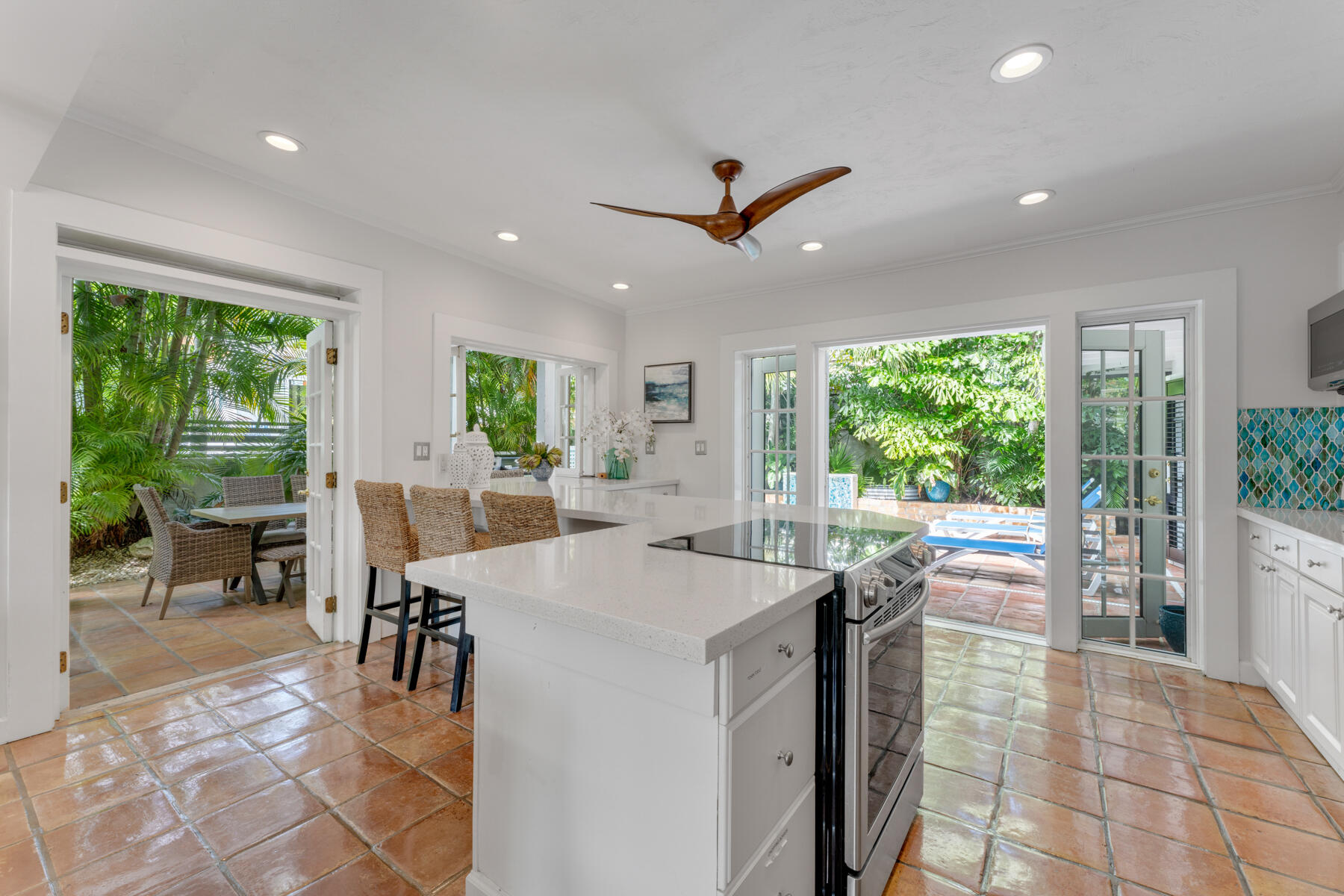 1511 Johnson Street Key West, FL 33040 - Photo 12 of 36 a view of a dining hall with furniture and a large window