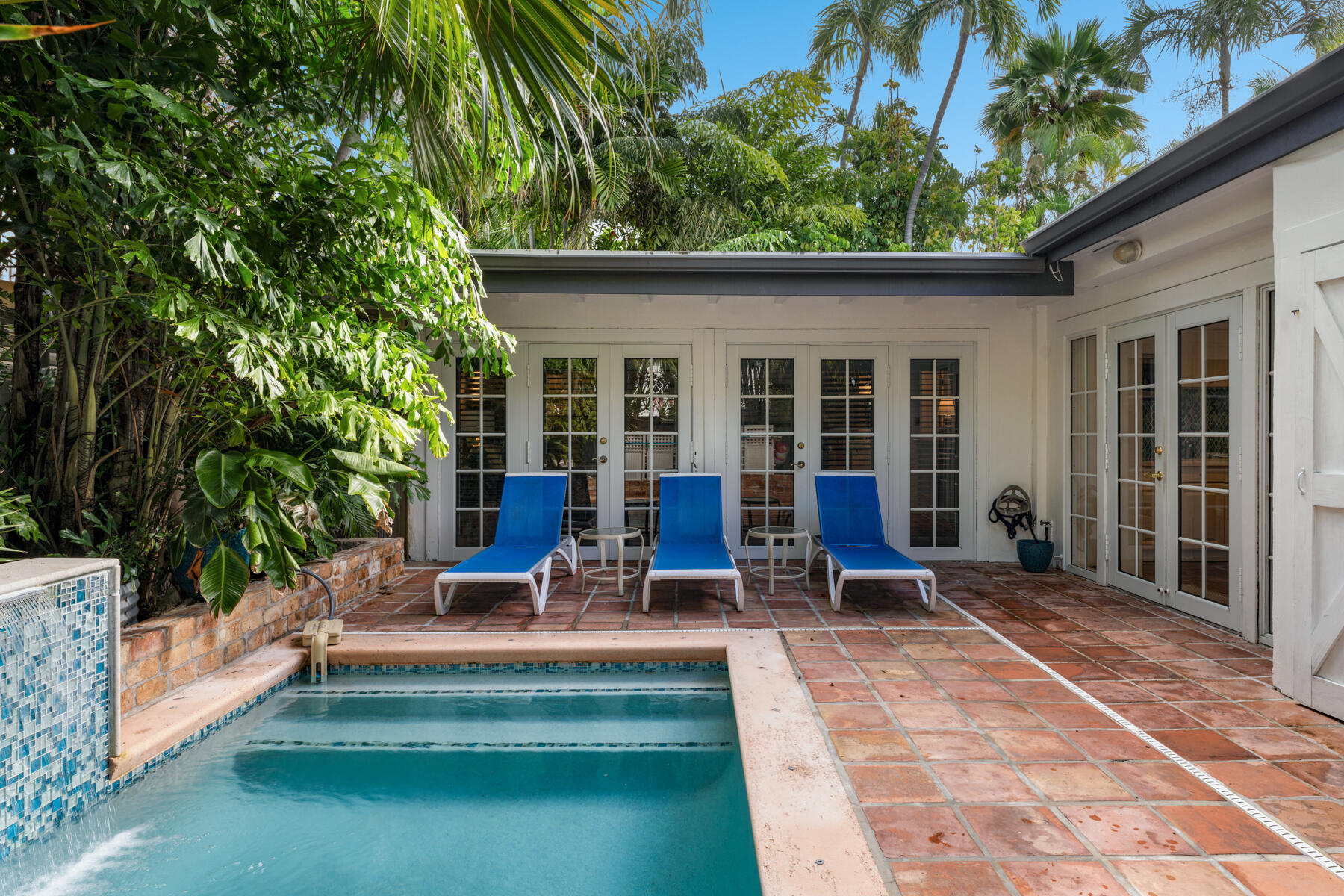 1511 Johnson Street Key West, FL 33040 - Photo 14 of 36 a view of a house with sitting area and garden