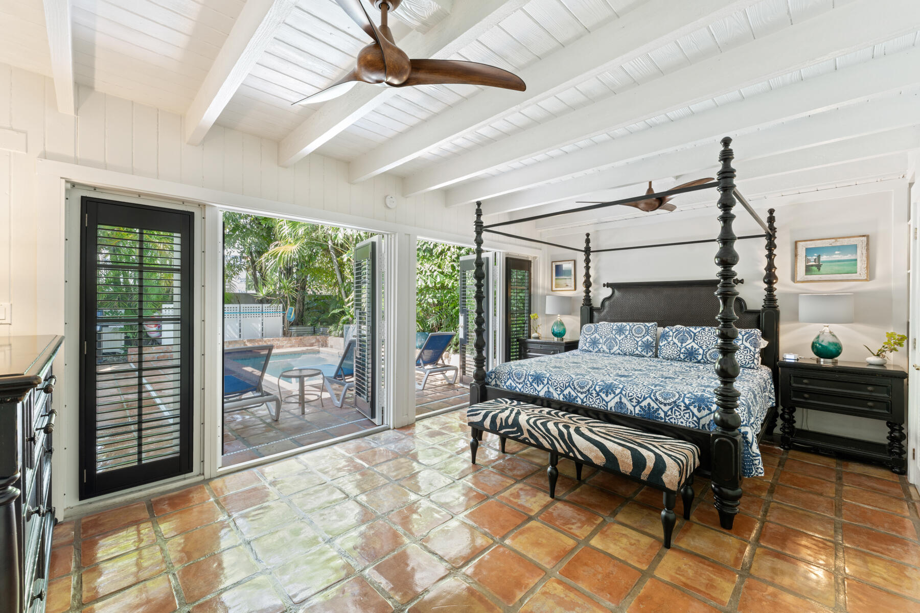 1511 Johnson Street Key West, FL 33040 - Photo 16 of 36 a bedroom with a bed and large windows