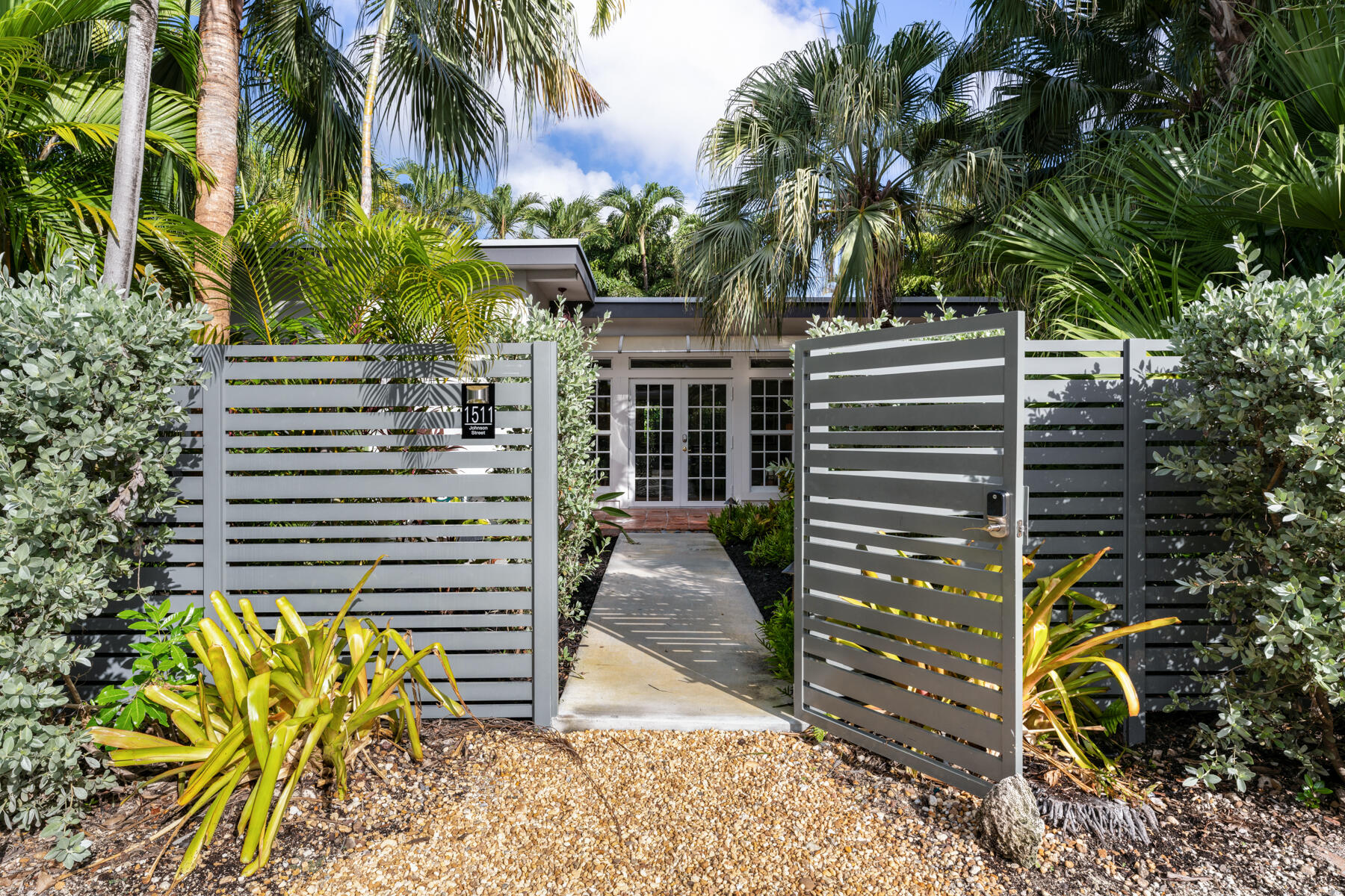 1511 Johnson Street Key West, FL 33040 - Photo 2 of 36 a house view with a garden space