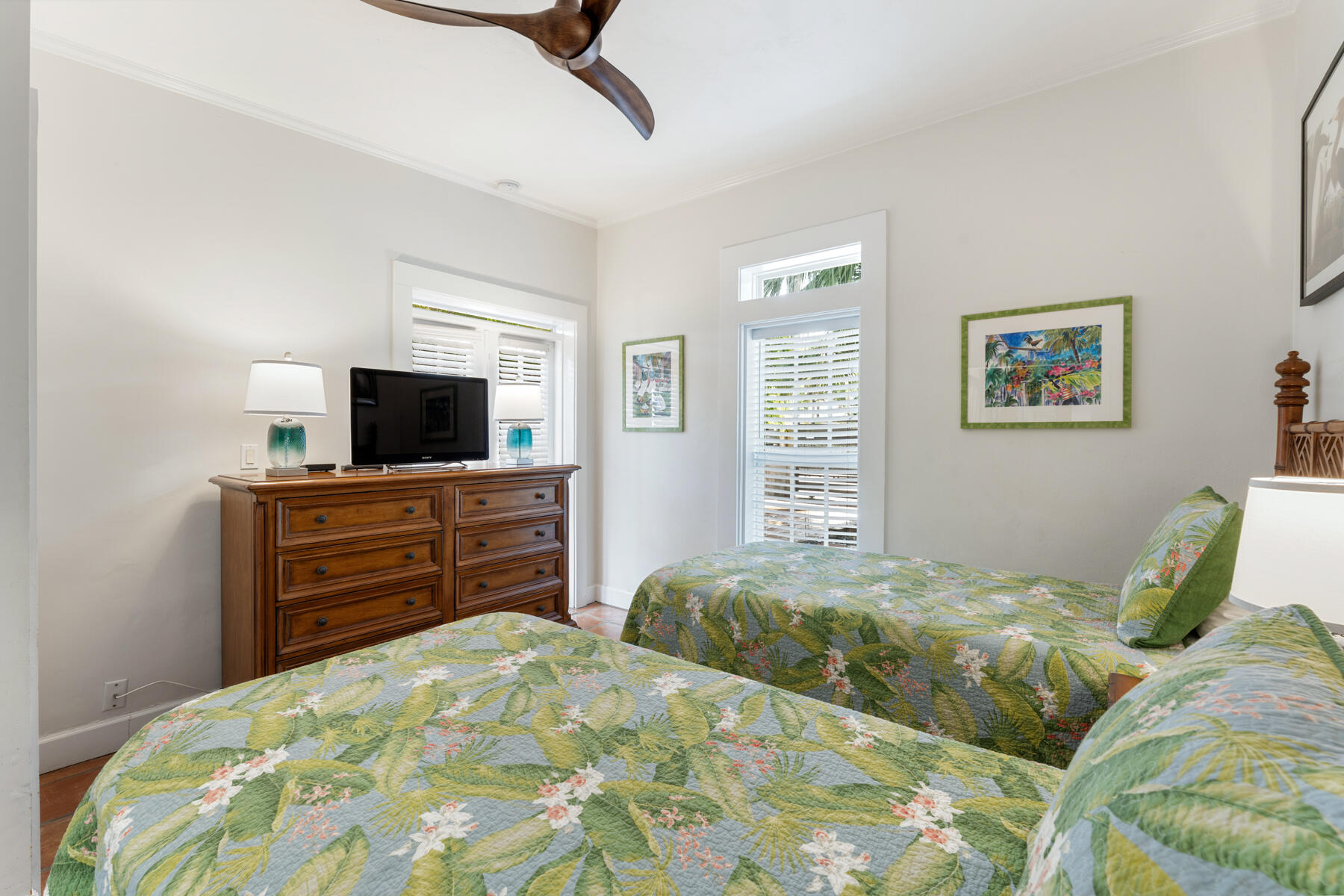 1511 Johnson Street Key West, FL 33040 - Photo 28 of 36 a bedroom with a bed and wooden floor