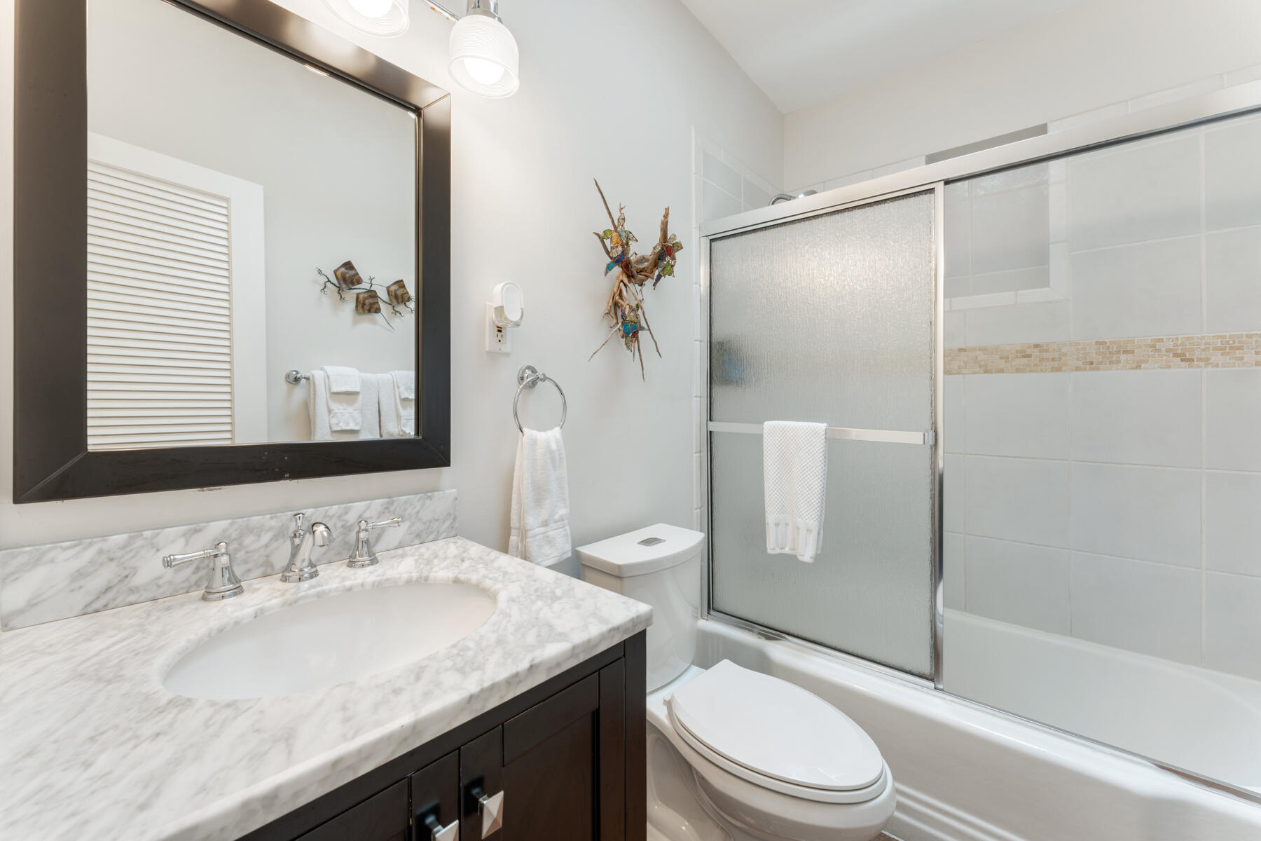 1511 Johnson Street Key West, FL 33040 - Photo 29 of 36 a bathroom with a granite countertop sink toilet and shower