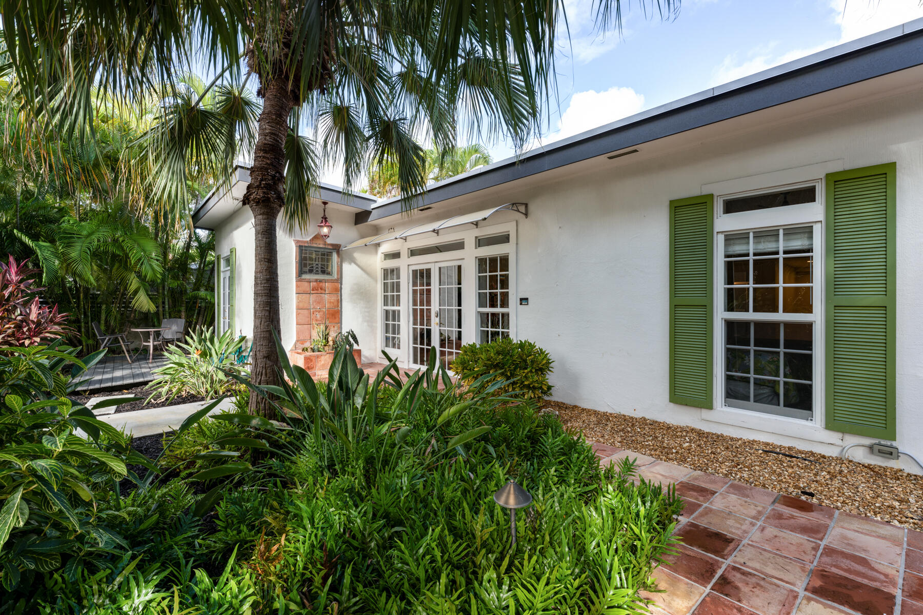 1511 Johnson Street Key West, FL 33040 - Photo 3 of 36 a front view of a house with a yard