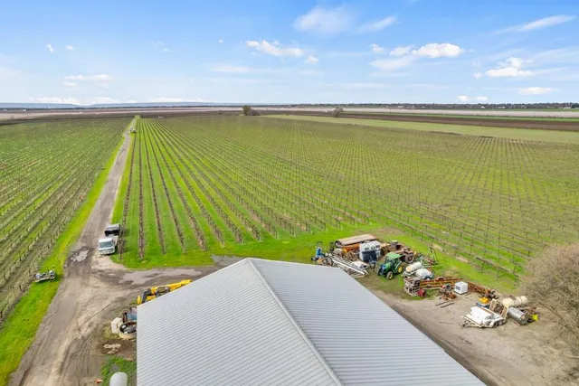 a view of a swimming pool with a yard