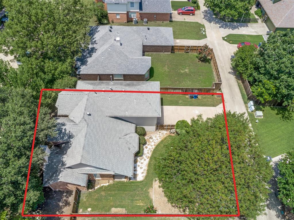 1215 Spring Creek Drive Allen, TX 75002 - Photo 35 of 40 Aerial perspective showcasing a property with a gray shingle roof and brick exterior