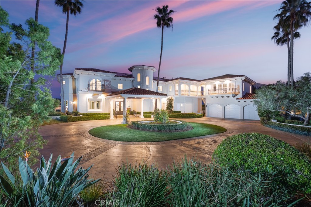 a view of a house with a yard and potted plants