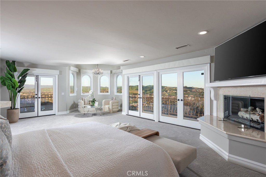 9 Wildflower Laguna Niguel, CA 92677 - Photo 18 of 47 a spacious bedroom with a large bed and a large window with outer view