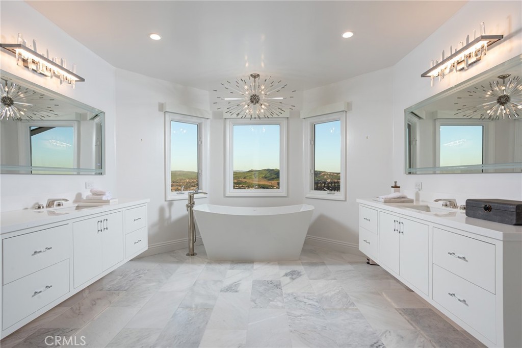 9 Wildflower Laguna Niguel, CA 92677 - Photo 20 of 47 a large bathroom with a large tub sink and double vanity
