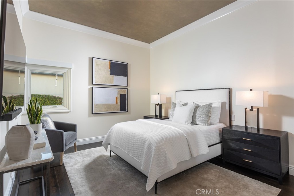 9 Wildflower Laguna Niguel, CA 92677 - Photo 23 of 47 a bedroom with a bed and wooden floor