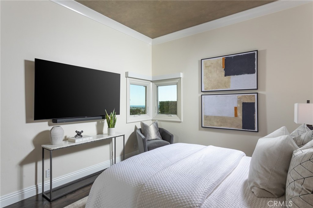 9 Wildflower Laguna Niguel, CA 92677 - Photo 24 of 47 a bedroom with a bed and a flat screen tv