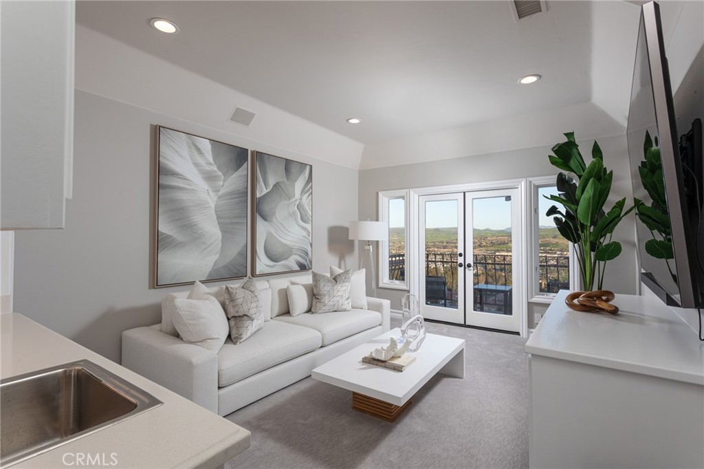 9 Wildflower Laguna Niguel, CA 92677 - Photo 26 of 47 a living room with furniture and a potted plant